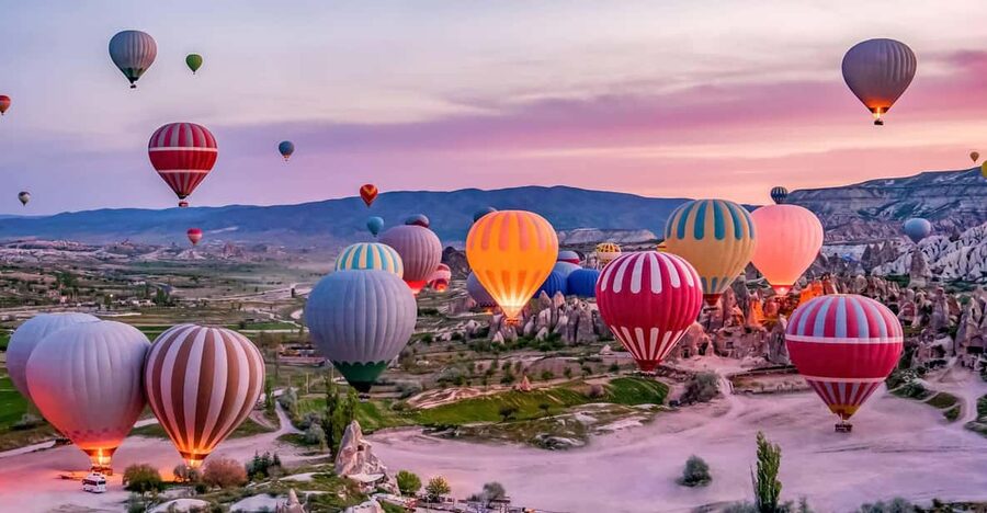 Hot air balloons over the Cappadocian valleys at first light