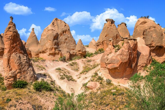 Daily Red Tour in Cappadocia - Devrent Valley: shaped rock formations built for photos