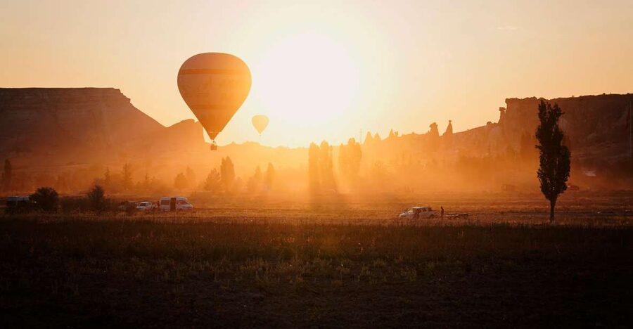 Hot air balloons in Goreme red valley - Why a Goreme red valley balloon flight feels different from the ground