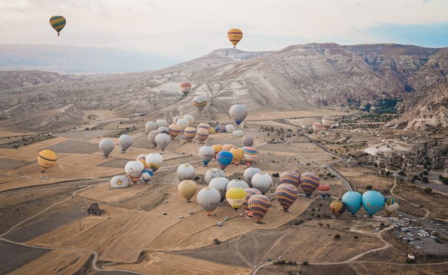 Hot air balloons in Goreme red valley - Over Pasabag, Uçhisar, and Kızılçukur from the air
